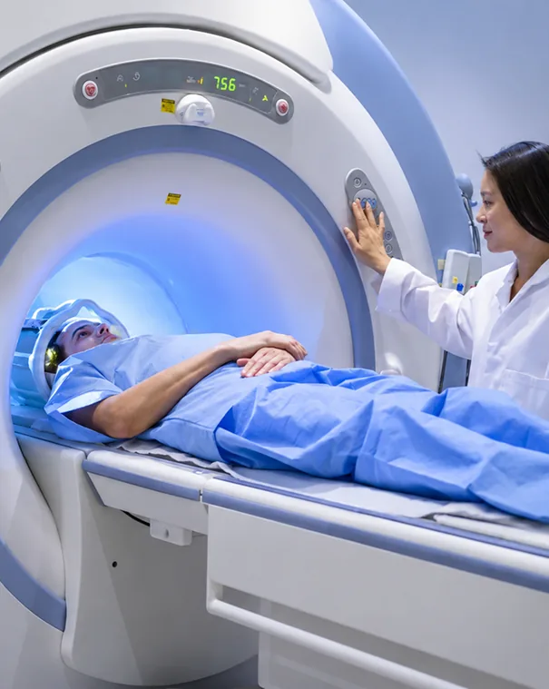 A Lucent technologist reassuring a patient before an MRI scan